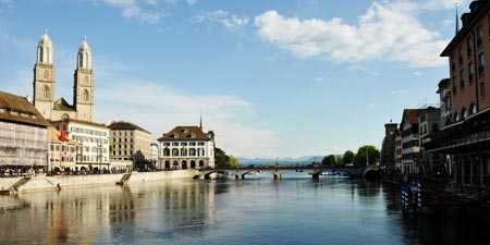 Walk along the Limmat river through downtown Zurich