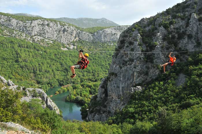 Adventure on the Zip Line high above the river Cetina