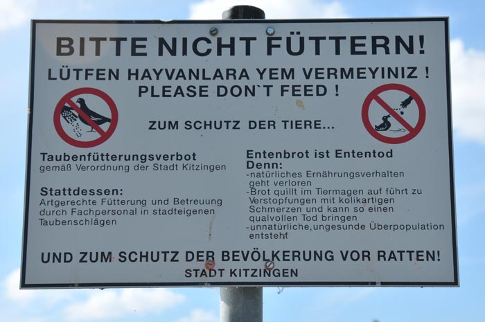 Different languages on the signboard in Kitzingen