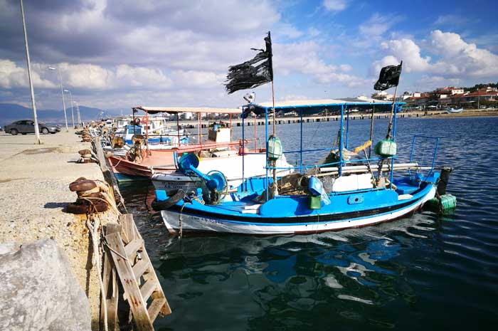 Bike ride along the coast of Perea - fishing boats along the way