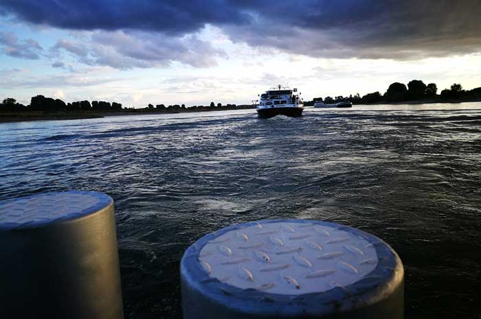 The Rhine ferry Langst-Kaiserswerth - dusk on Rhine river