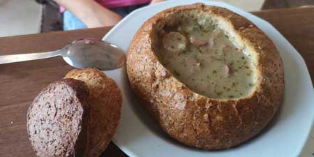 Zurek soup served in a bread bowl in Rewa