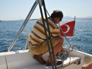 Sailing along Izmir coastline with friend