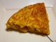 Tortilla with peeled potatoes and peppers